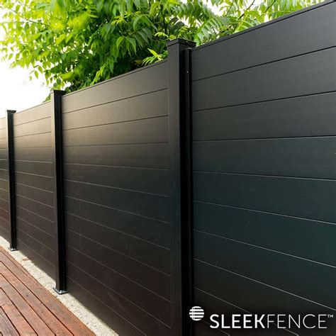 big house with black metal fence|black privacy fence designs.